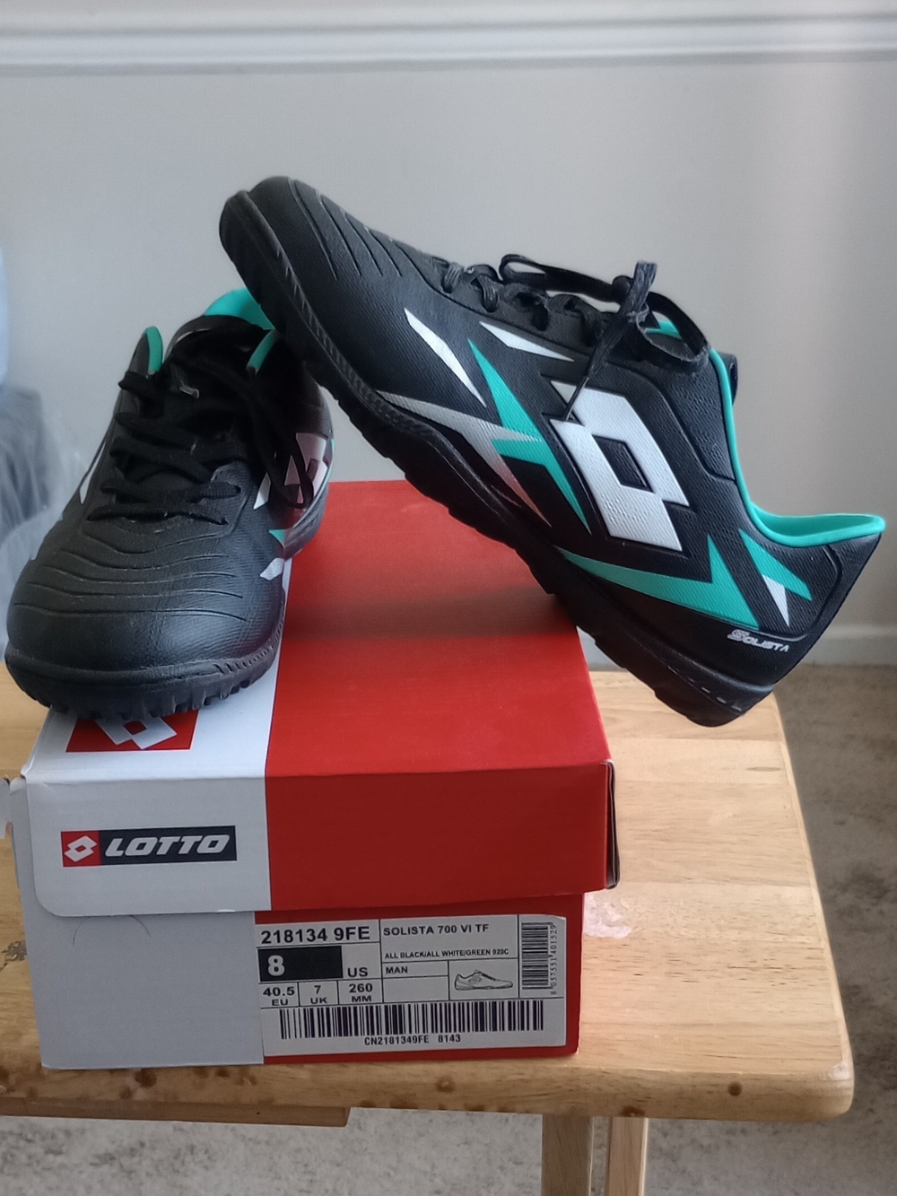 LOTTO Men's Solista 700 VI TF Soccer Cleats in Black/Teal
